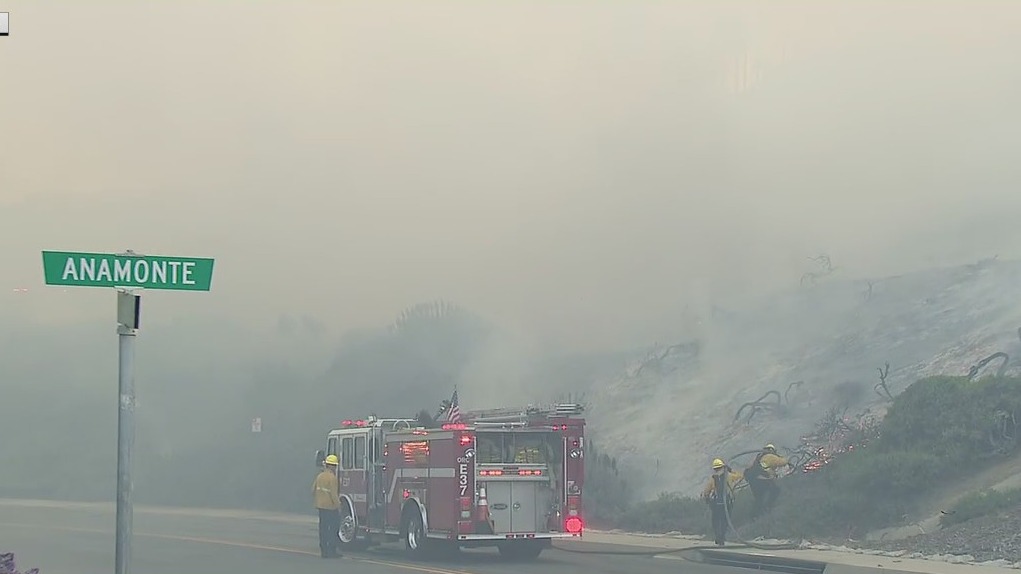 Coastal Fire: Onshore winds causing fire to spread across neighborhood