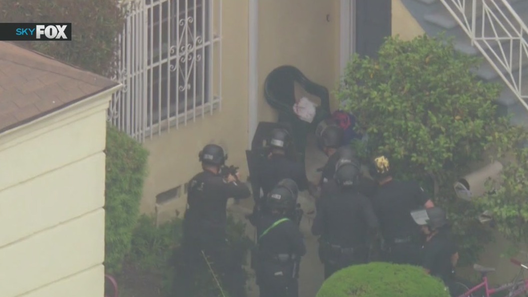 Gun-wielding man shot by LAPD officers in Fairfax District: officials