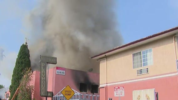Fire crews work to knock down fire burning in Hollywood