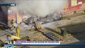 FOX 11's Stu Mundel informs authorities of house fire in Pomona
