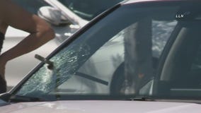 Pole pierces through car windshield