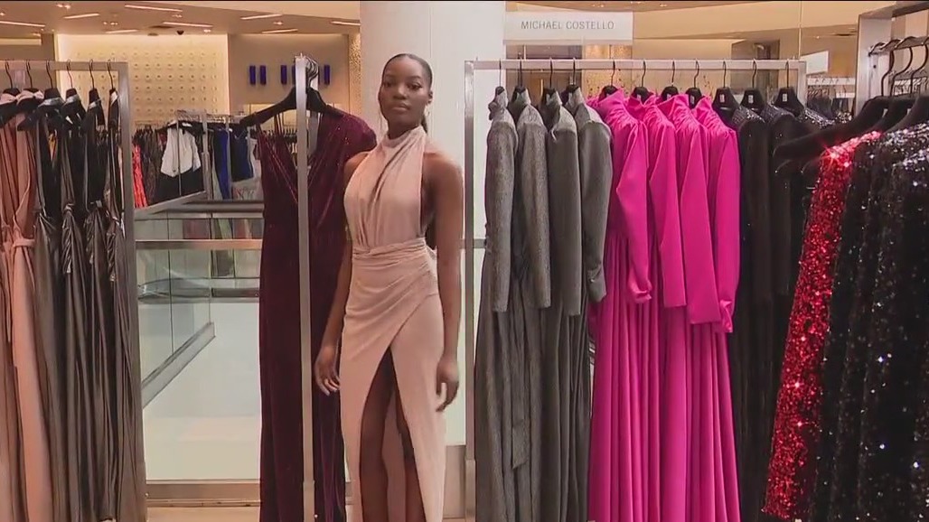 Amanda Salas visits with fashion designer, Michael Costello