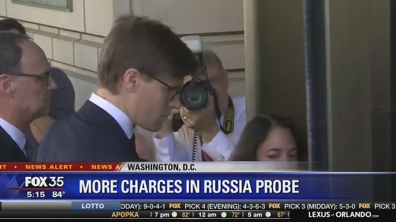 New charges in Russia probe