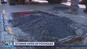 Storms open up potholes