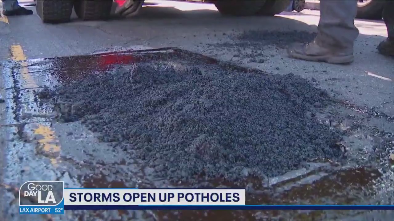 Storms open up potholes