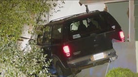 Pursuit suspect crashes into 2 Encino homes