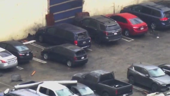 Cars damaged by tornado in Montebello