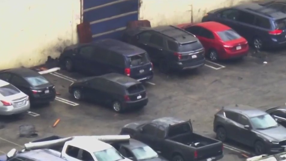 Cars damaged by tornado in Montebello