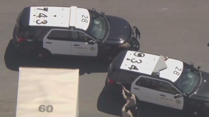 LASD cruiser reverses while trying to pin pursuit suspect in