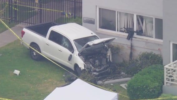 Truck slams into Mid-Wilshire apartment building near school