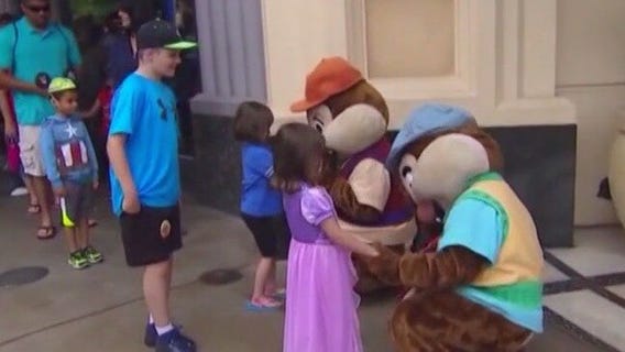 Parents debate pressure to visit Disney