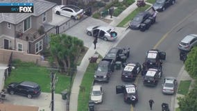 Armed suspect surrenders after police pursuit