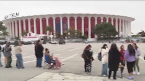 Suga fans wait outside Kia Forum ahead of Inglewood concert