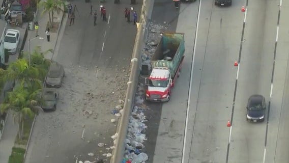 Debris rain down on South LA street below
