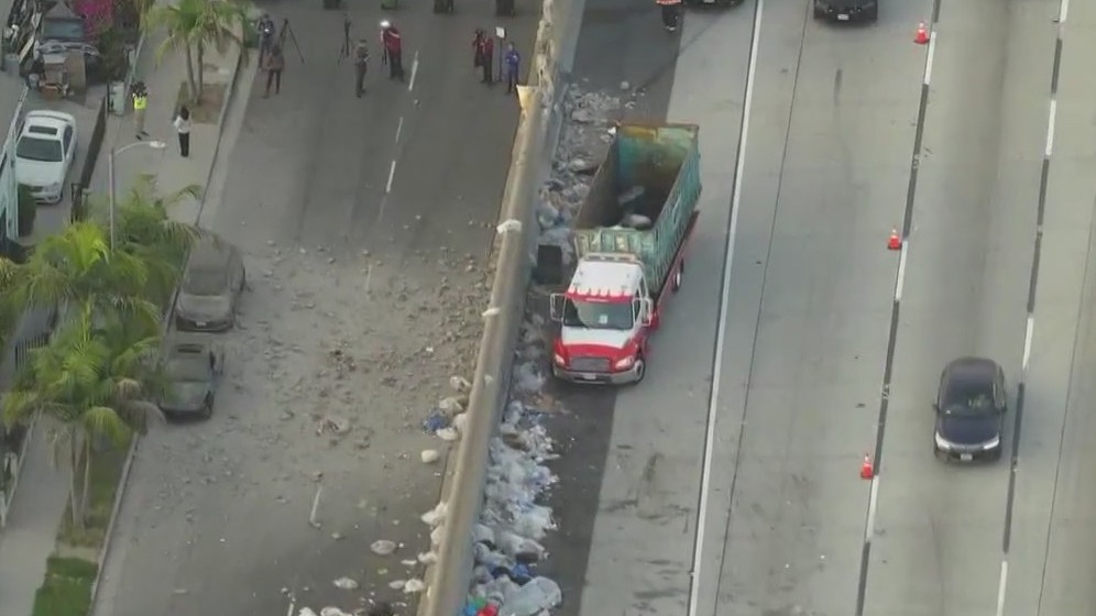 Debris rain down on South LA street below