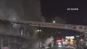 Encampment fire spreads to businesses