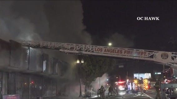 Encampment fire spreads to businesses