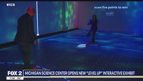 Virtual reality air hockey at Level Up at Michigan Science Cetner