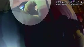 Melina Abdullah reacts to deputy punching woman holding baby