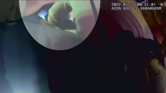 Melina Abdullah reacts to deputy punching woman holding baby