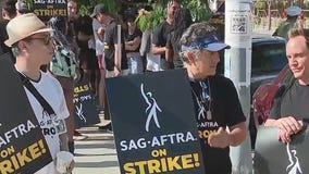 Hollywood workers brave heat for solidarity march