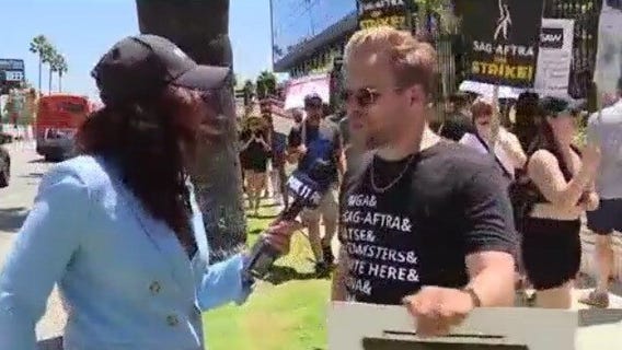Comedian Adam Conover joins picketers
