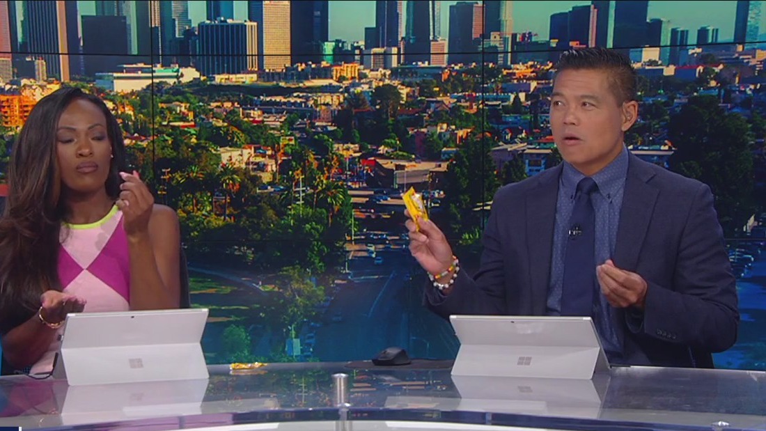Good Day LA crew taste tastes mustard-flavored Skittles