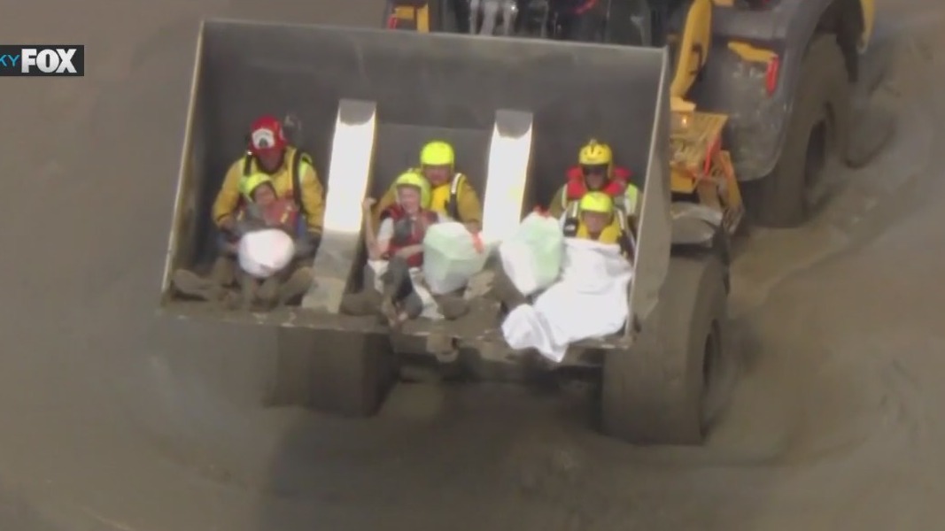 People rescued in Hilary floods placed on front loader