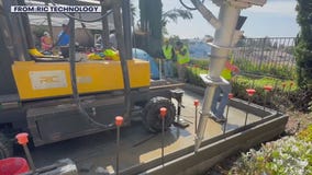 3D printing robotic arm builds ADU