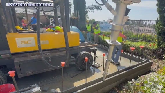 3D printing robotic arm builds ADU