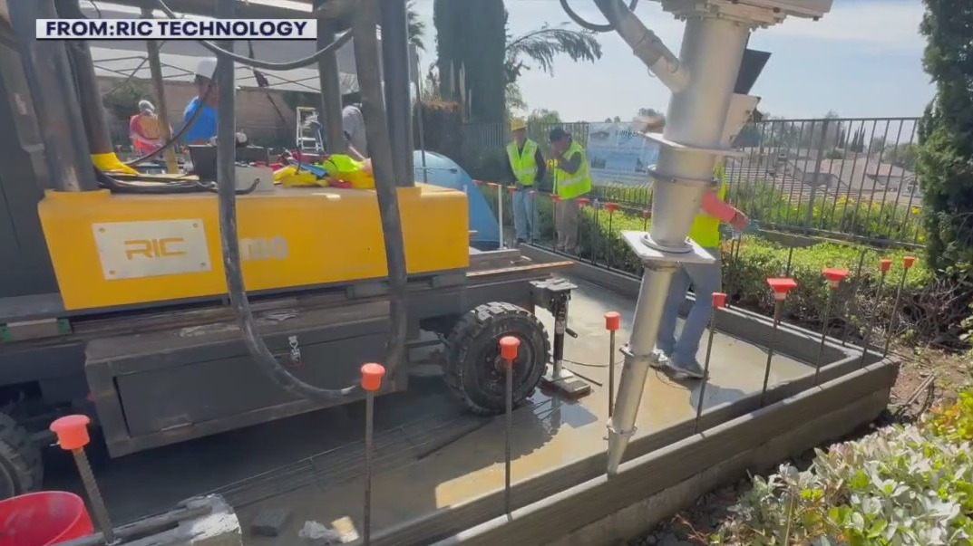 3D printing robotic arm builds ADU