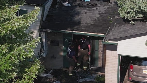 Warren home hit by tree, lit on fire after severe weather