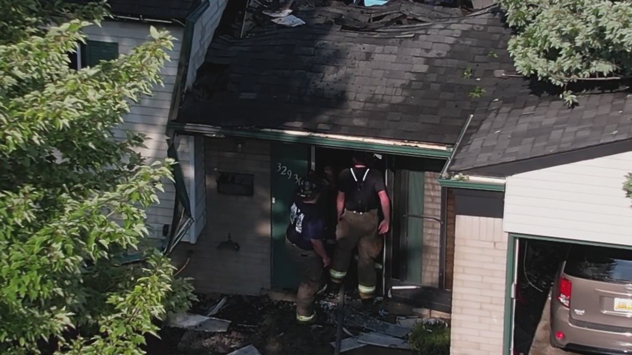 Warren home hit by tree, lit on fire after severe weather