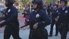 Police march towards pro-Palestine protesters