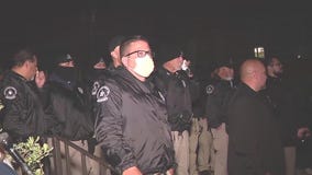 Private security standing still amidst chaos