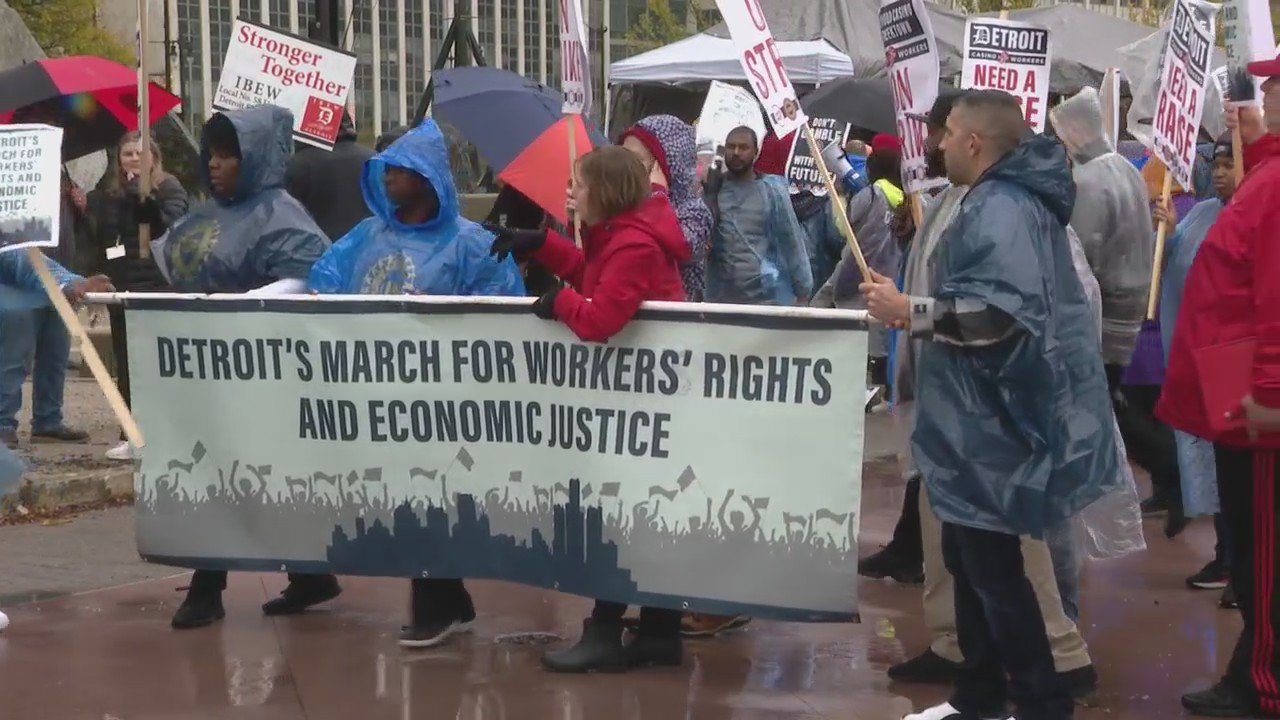 Striking workers march in downtown Detroit