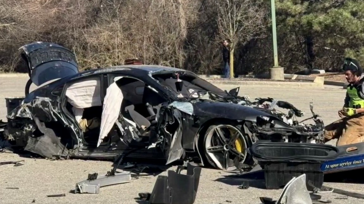 Three injured after Porsche flies through air, crashes