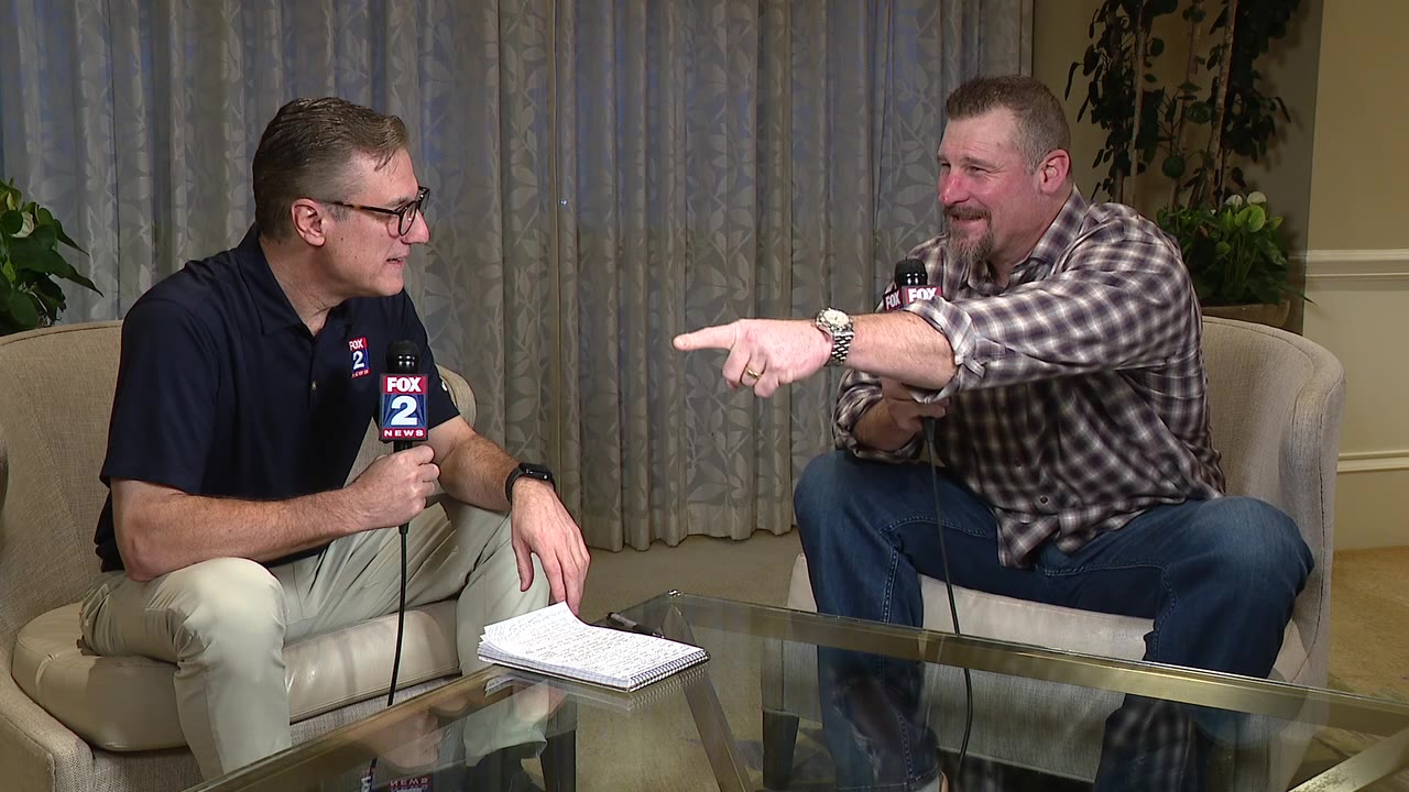 Lions head coach Dan Campbell talks with Dan Miller at Annual League Meetings