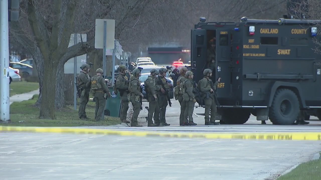 Ex-football player charged after hours-long stand-off with police