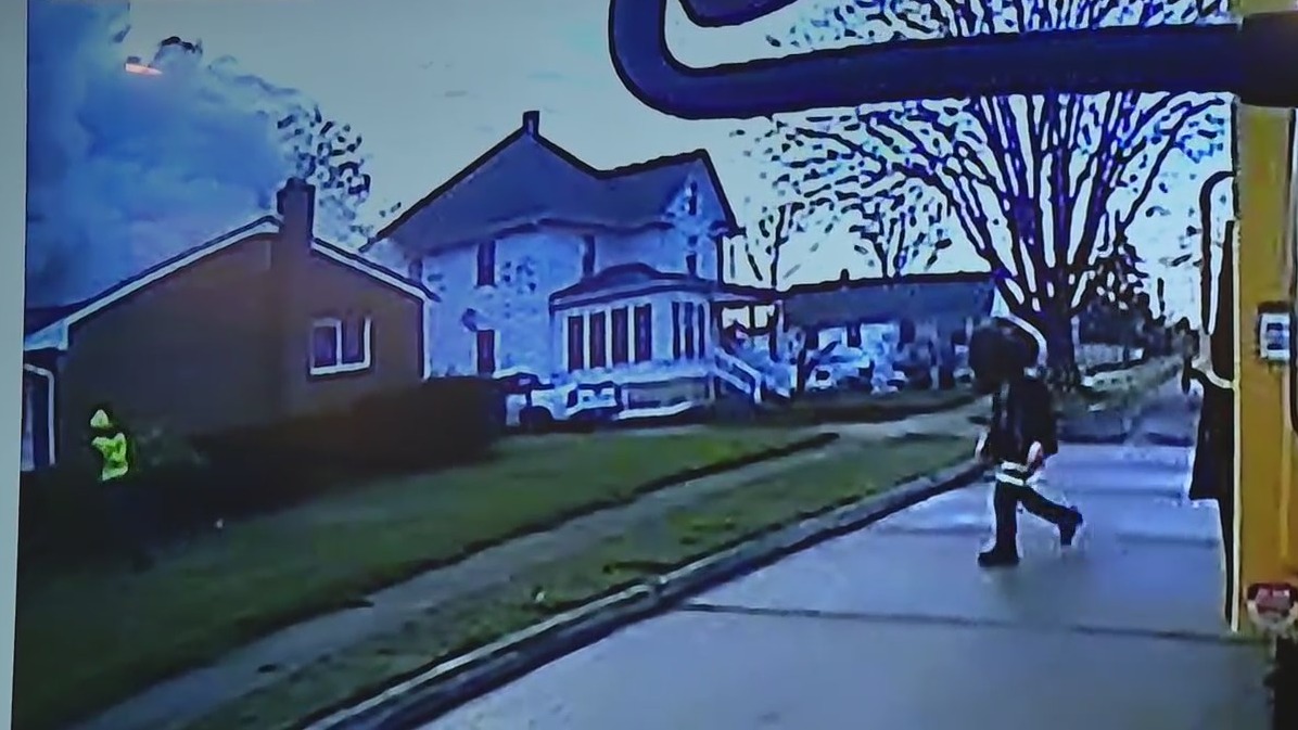 WATCH: Sanitation workers rescue woman from burning home