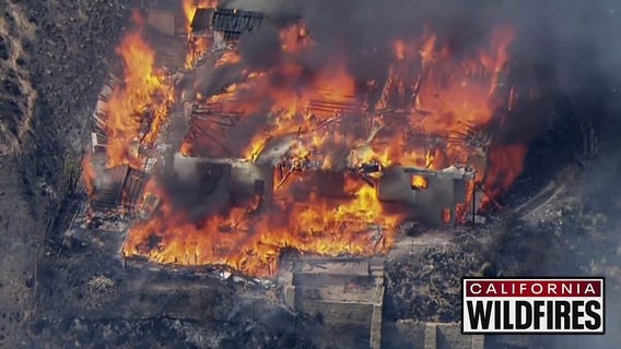 Wildfire destroys homes: Full coverage