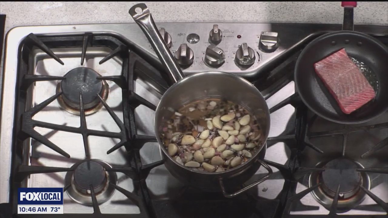 Award winning steakhouse Eddie Merlot's showcases its summer menu. Executive Chef Destin M. Slyvester makes a pan-roasted salmon with crispy lobster risotto cake.