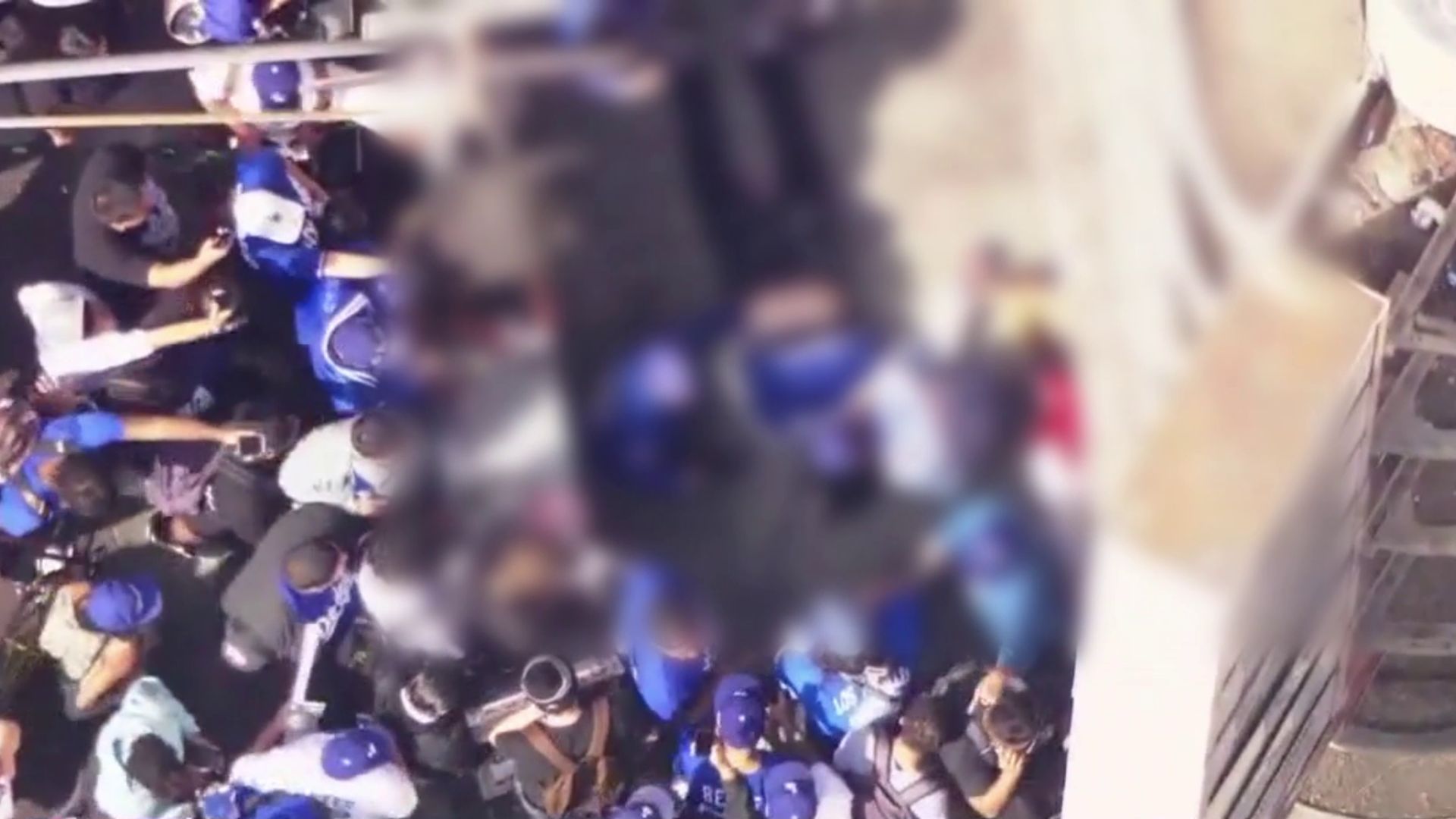 Dodgers fan possibly falls off roof