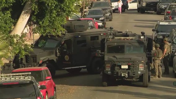 East LA barricaded suspect surrenders