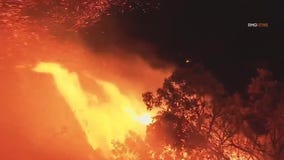 Firefighters race to save homes in Malibu