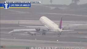 Delta plane leaving LAX nearly hits another jet