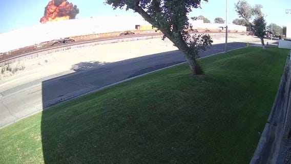 2 dead after plane crashes into building