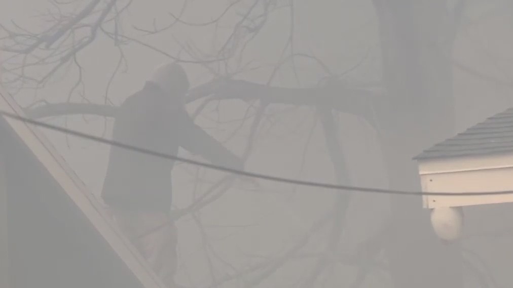 Altadena man tries to save home amid massive blaze