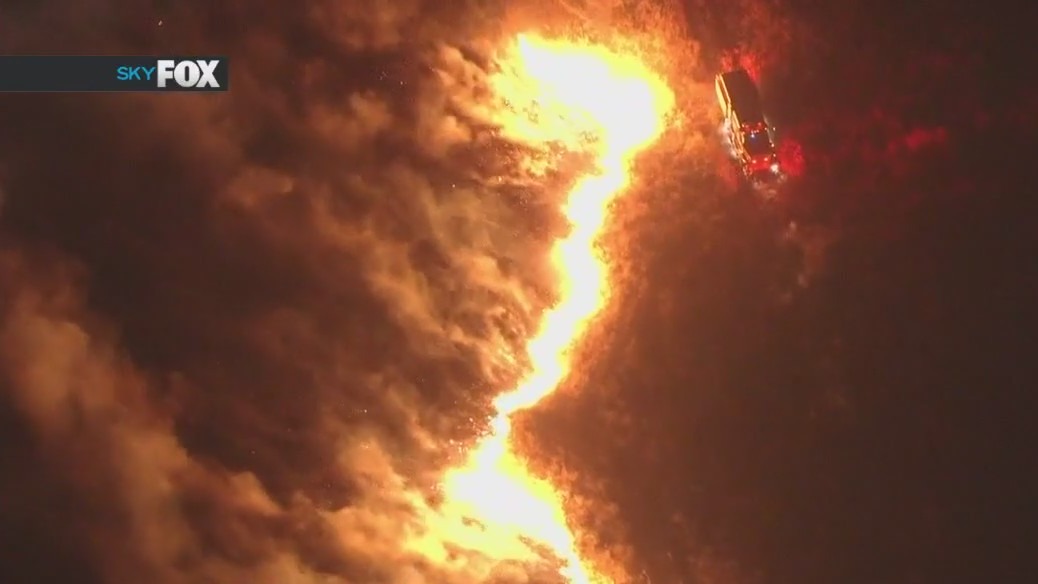 Wildfires burn across Southern California