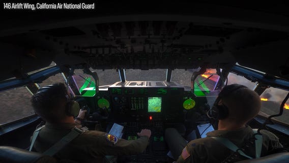 Listen & watch: Retardant drop on Hughes Fire